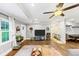 Inviting living area with hardwood floors, large windows, and stylish decor leading to the dining area at 2123 Garden Cir, Decatur, GA 30032