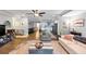 Open-concept living area flows into a modern kitchen with stainless steel appliances and large kitchen island at 2123 Garden Cir, Decatur, GA 30032