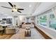 Bright and open living space with hardwood floors, large windows, and an open connection to the kitchen at 2123 Garden Cir, Decatur, GA 30032