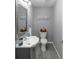 Charming powder room featuring modern fixtures and gray walls at 2123 Garden Cir, Decatur, GA 30032