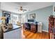 Dedicated home office with hardwood floors, natural light, and ceiling fan at 22107 Harvest Ridge Lane # 22, Alpharetta, GA 30022