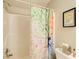 Bright bathroom featuring a shower with tub, decorative shower curtain, and neutral walls at 3030 Larkspur Ct, Cumming, GA 30041