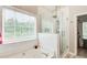 Bathroom highlighting glass enclosed shower and separate tub at 3030 Larkspur Ct, Cumming, GA 30041