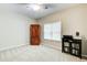 Comfortable bedroom features a window, closet, and a reading nook at 3030 Larkspur Ct, Cumming, GA 30041