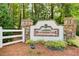 Stone Heatherstone neighborhood sign with manicured landscaping and privacy fence at 3030 Larkspur Ct, Cumming, GA 30041