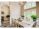 Elegant dining room with hardwood floors, large windows, and contemporary lighting fixture at 3030 Larkspur Ct, Cumming, GA 30041