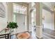 Welcoming foyer with high ceilings, modern lighting, hardwood floors, and an arched entryway at 3030 Larkspur Ct, Cumming, GA 30041