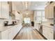 Kitchen featuring a range hood, and open concept access to breakfast nook at 3030 Larkspur Ct, Cumming, GA 30041