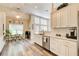 Bright kitchen features white cabinets, stainless steel appliances, and an eat-in breakfast nook at 3030 Larkspur Ct, Cumming, GA 30041