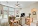 Bright living room featuring a fireplace, large windows, and comfortable seating arrangement at 3030 Larkspur Ct, Cumming, GA 30041