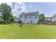 Lush backyard with fire pit and furniture at 3153 Morgan Box Ne Ln, Buford, GA 30519