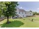 Wide view of the home's backyard and patio at 3153 Morgan Box Ne Ln, Buford, GA 30519