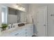 Bathroom featuring a double sink vanity with marble countertop and a large mirror reflecting the shower at 3153 Morgan Box Ne Ln, Buford, GA 30519
