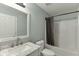 Bathroom with a white vanity with marble countertop, a shower and a toilet at 3153 Morgan Box Ne Ln, Buford, GA 30519