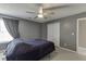 Bedroom featuring a bed with blue bedding, a ceiling fan, a window and a closet at 3153 Morgan Box Ne Ln, Buford, GA 30519