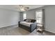 Bedroom featuring a grey daybed with a ceiling fan and two windows that provide ample natural light at 3153 Morgan Box Ne Ln, Buford, GA 30519