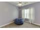 Cozy bedroom with a large beanbag chair and a ceiling fan at 3153 Morgan Box Ne Ln, Buford, GA 30519