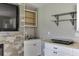 The kitchenette features white cabinets and stainless steel sink, with accent shelving at 3153 Morgan Box Ne Ln, Buford, GA 30519