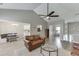 Inviting living room with wood-look floors and views into the kitchen and dining areas at 3153 Morgan Box Ne Ln, Buford, GA 30519