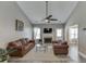 Bright living room features wood-look floors, fireplace, and vaulted ceiling with fan at 3153 Morgan Box Ne Ln, Buford, GA 30519