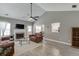 Spacious living room with vaulted ceiling, fireplace, and wood-look floors at 3153 Morgan Box Ne Ln, Buford, GA 30519