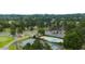 View of community amenities including swimming pool, tennis courts, parking, and green space at 913 Sundown Pt, Villa Rica, GA 30180
