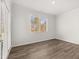 Bedroom with abundant natural light, neutral walls, and new hardwood flooring at 913 Sundown Pt, Villa Rica, GA 30180