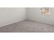 Neutral carpeted bedroom with window and natural light at 913 Sundown Pt, Villa Rica, GA 30180