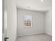 Bright bedroom with neutral carpet and natural light from the window at 913 Sundown Pt, Villa Rica, GA 30180