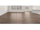 Spacious open-concept living space with wood-style floors and bright windows at 913 Sundown Pt, Villa Rica, GA 30180