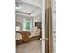 Bedroom featuring a tufted headboard, a ceiling fan, and a bathroom entrance at 165 Winner St, Acworth, GA 30102