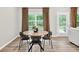 Cozy dining area features a wooden table, stylish seating, and natural light at 165 Winner St, Acworth, GA 30102