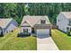 Charming home with stone accents, well-manicured lawn, and a spacious two-car garage at 165 Winner St, Acworth, GA 30102