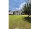 Lush backyard with ample green space and a fenced perimeter, great for outdoor activities at 2147 Saint Albans Pl, Buford, GA 30519