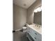 Modern bathroom featuring a stylish vanity with a mirror and a clean, well-maintained toilet at 2147 Saint Albans Pl, Buford, GA 30519