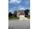 Charming two-story home featuring a well-maintained front yard and attached garage at 2147 Saint Albans Pl, Buford, GA 30519