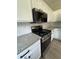 Modern kitchen featuring stainless steel appliances, granite countertops, and white cabinets at 2147 Saint Albans Pl, Buford, GA 30519