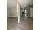Spacious living area showcasing modern flooring and neutral paint, with open access to other rooms at 2147 Saint Albans Pl, Buford, GA 30519