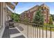 Balcony with grill, overlooking well-maintained building and landscaped grounds at 304 Stonemont Dr, Atlanta, GA 30305