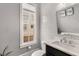 Charming powder room featuring modern fixtures, elegant wallpaper, and a window with bright natural light at 304 Stonemont Dr, Atlanta, GA 30305