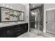 Modern bathroom with double vanity, marble countertops, and a sleek glass-enclosed shower for a spa-like experience at 304 Stonemont Dr, Atlanta, GA 30305