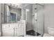 Modern bathroom with glass-enclosed shower, marble counters, and black and white accent tiles at 304 Stonemont Dr, Atlanta, GA 30305