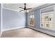 Cozy bedroom with blue walls, white trim, and two windows providing natural light at 304 Stonemont Dr, Atlanta, GA 30305