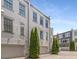 Exterior view of townhomes with brick facade and attached garages at 304 Stonemont Dr, Atlanta, GA 30305