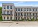 Charming townhomes with awnings and beautiful landscaping offer inviting curb appeal at 304 Stonemont Dr, Atlanta, GA 30305