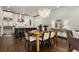 Dining area features chandelier, and views to the kitchen with stainless steel appliances and an island at 304 Stonemont Dr, Atlanta, GA 30305