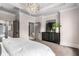 Spacious main bedroom with a dresser and entry door to the bathroom at 304 Stonemont Dr, Atlanta, GA 30305