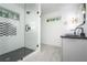 Contemporary bathroom boasts a glass enclosed shower and sleek black fixtures at 3200 Lowndes St, East Point, GA 30344