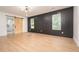 Spacious primary bedroom with board and batten wall and ensuite bathroom at 3200 Lowndes St, East Point, GA 30344