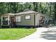 Charming home featuring a landscaped front yard, covered porch, and a freshly painted exterior at 3200 Lowndes St, East Point, GA 30344